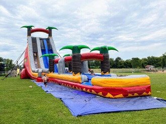 https://ajassets.nyc3.cdn.digitaloceanspaces.com/AJ-COM/products/thumbs/tiny_800_356_Baltimore_27'_Blazing_Tropics_Dual_Lane_Water_Slide_on_a_fiels.jpg